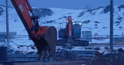 Earthwork at a construction site , an excavator digs a place for a foundation Stock Footage 147626249