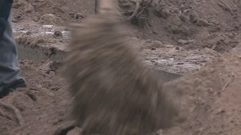 Earthworks, man digging trench using shovel. 스톡 동영상 330346183