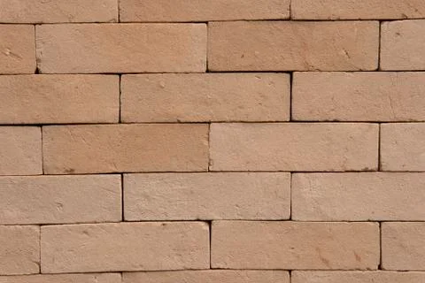 Earthy rustic brick texture background. Stock Photos