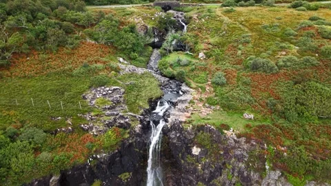 Eas Fors Waterfall Cascading Down Basalt Cliffs to Sea, Isle of Mull Stock Footage 346556011