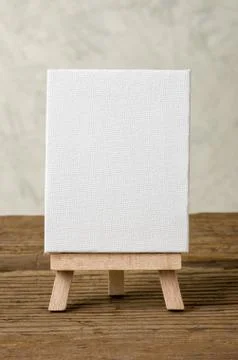 Easel with a blank canvas Стоковые фото