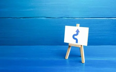 An easel with a curved arrow avoiding an obstacle. Deviation from route, s... 写真素材