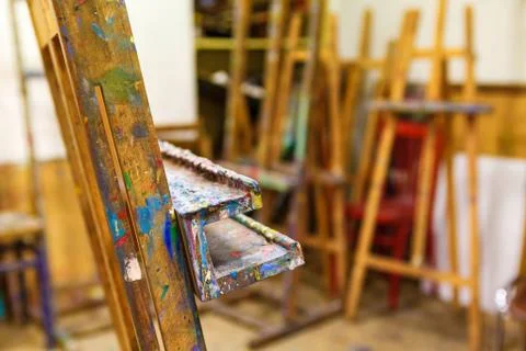 Easel smeared with paint Stock Photos