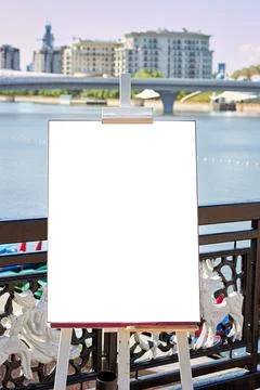 Easel with a white sheet is in the Park. Stock Photos