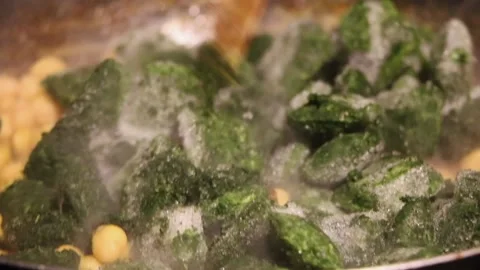 The easiest way to prepare spinach with chickpea Stock Footage 131752487