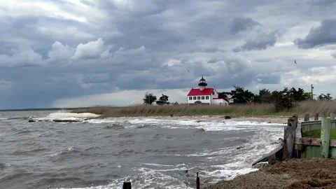 East Point Lighthouse on a Stormy Cloudy Day with Rough Delaware Bay Stock Footage 240694906