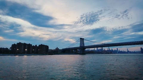 East River Camera Pan from Williamsburg Bridge toward Midtown Manhattan at Blue Stock Footage 340870871