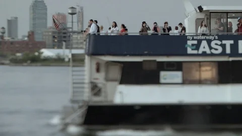 East River ferry undocking. Brooklyn Station. Maneuvering. People on upper deck. Stock Footage 75327982
