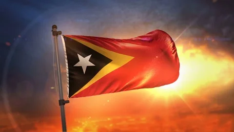 East Timor Flag Backlit At Beautiful Sunrise Loop Slow Motion 4K Stock Footage 76331165
