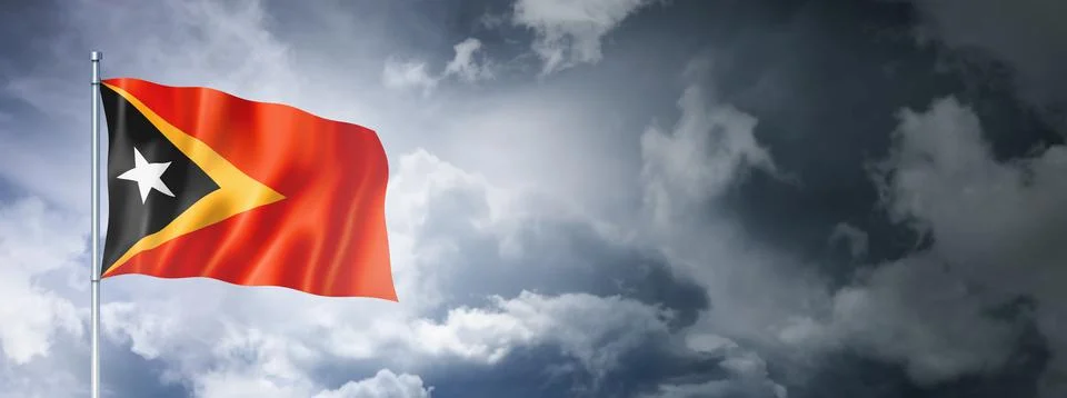 East Timor flag on a cloudy sky 스톡 일러스트