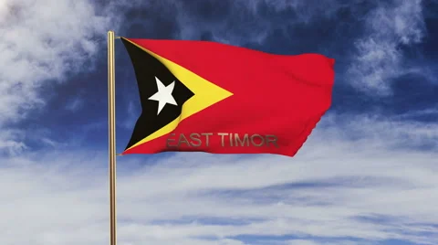 East Timor flag with title waving in the wind. Looping sun rises style Stock Footage 48961530