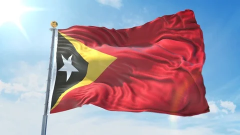 East Timor flag waving in the wind against deep blue sky. National theme. Stock Footage 123982541
