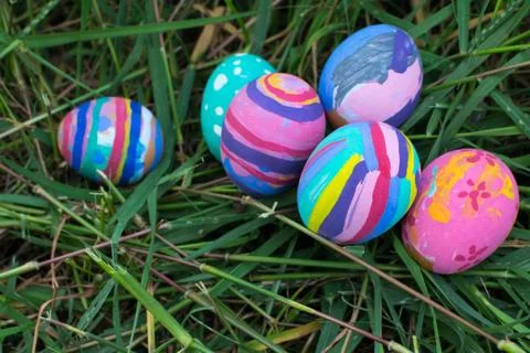 EastEaster eggs in Green Grass. Selective focus. Stock Photos