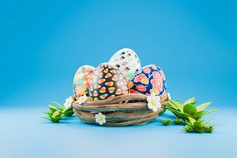 Easter 3D nest with decorated eggs on blue background Stock Illustration