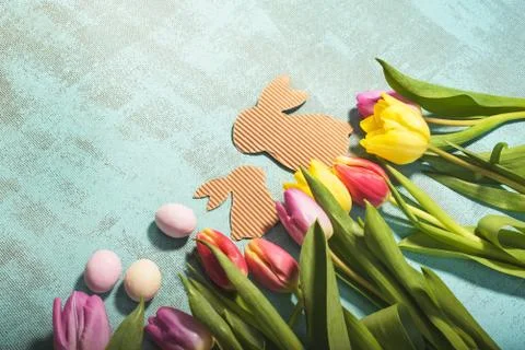 Easter and spring background with tulips and eggs. Stock Photos
