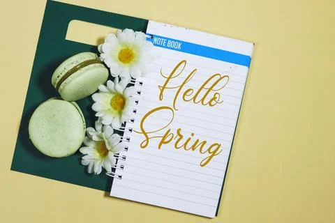 Easter and spring flat lay with macaron on a yellow background Stock Photos