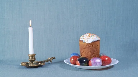 Easter Arrangement, Easter in the White Plate with Dyed Eggs, Nearby Burning Stock Footage 88299019