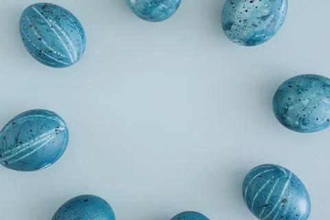 Easter background of blue Easter eggs on a soft blue background with space for Stock Photos