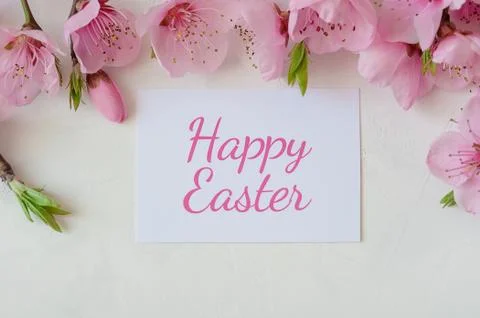 Easter background with a bouquet of spring flowers and the inscription happy Stock Photos