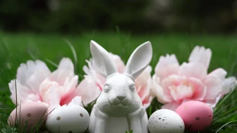 Easter background with bunny, eggs and flowers on green nature background Stock Footage 268982014