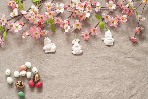 Easter background with colored easter eggs and blooming brunches. Stock Photos