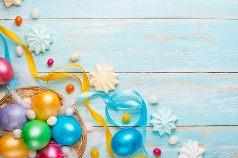 Easter background, with colored eggs and sweets Stock Photos