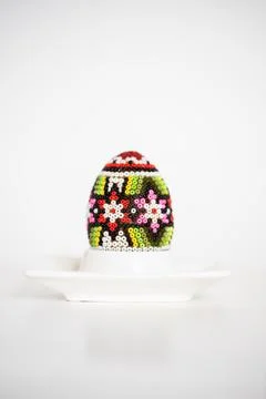 Easter background colored eggs and daffodils on white Stock Photos