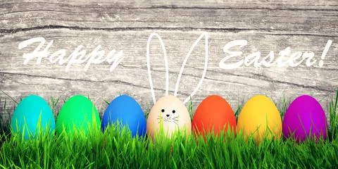Easter background with colorful easter eggs on wooden background. Stock Photos