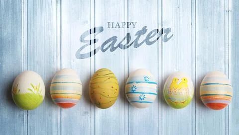 Easter background with colorful easter eggs on wooden background. Stock Photos