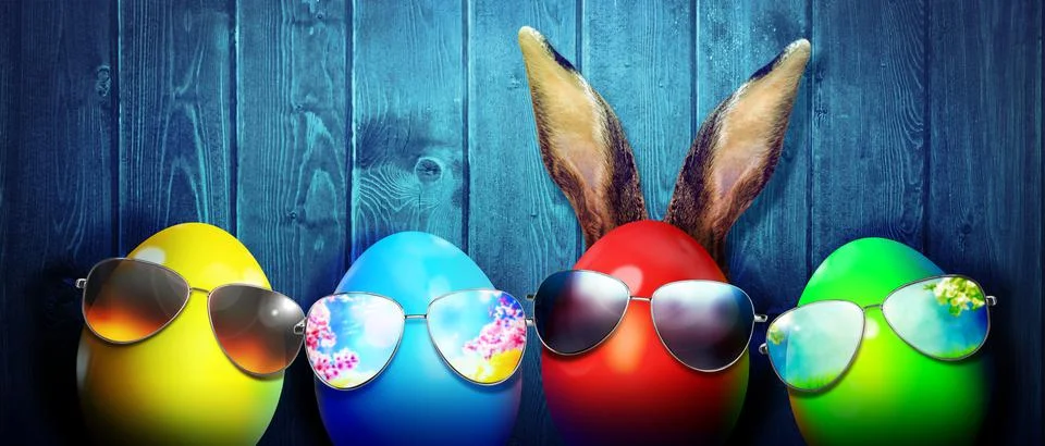 Easter background with colorful easter eggs on wooden background. Stock Photos