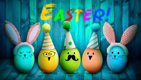 Easter background with colorful easter eggs on wooden background. Stock Photos
