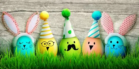 Easter background with colorful easter eggs on wooden background. Stock Photos