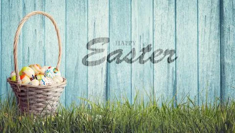 Easter background with colorful easter eggs on wooden background. Stock Photos