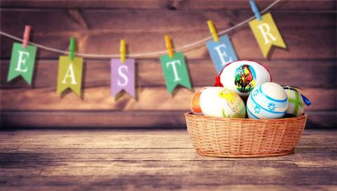 Easter background with colorful easter eggs on wooden background. Stock Photos