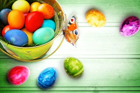Easter background with colorful easter eggs on wooden background. Stock Photos