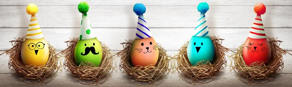 Easter background with colorful easter eggs on wooden background. Stock Photos