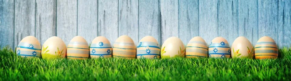 Easter background with colorful easter eggs on wooden background. Stock Photos