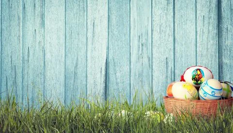 Easter background with colorful easter eggs on wooden background. Stock Photos