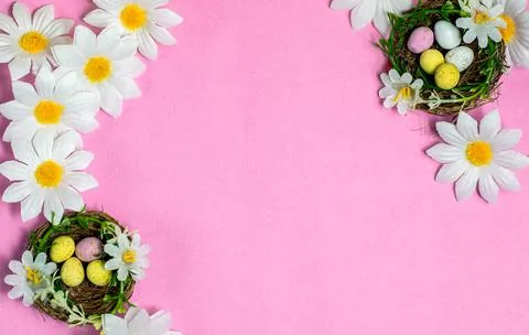 Easter background. Colourful easter eggs and flowers. Stock Photos