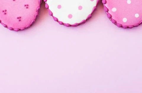Easter background concept. Polka dot easter egg cookies on a pink background. Stock Photos