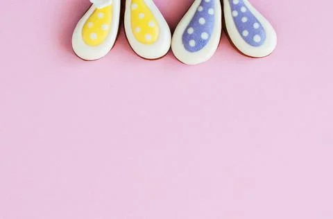 Easter background concept. Polka dot easter bunny cookies on a pink backgroun Stock Photos
