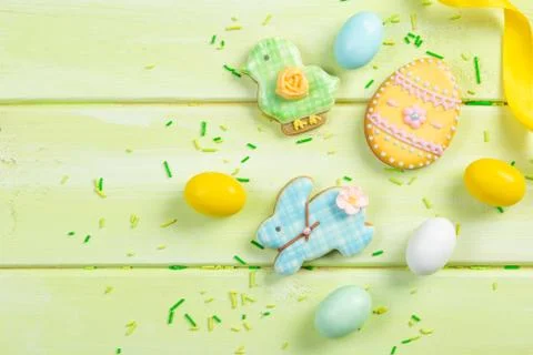 Easter background - cookies shaped like eggs, flowers, bunnies Stock Photos