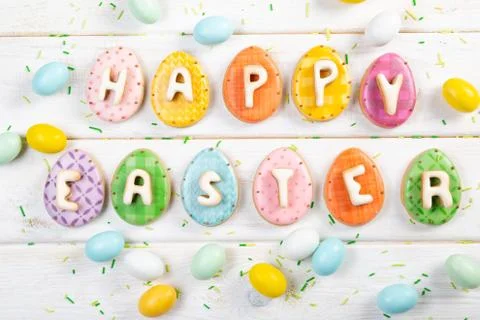 Easter background - cookies shaped like eggs, flowers, bunnies Stock Photos