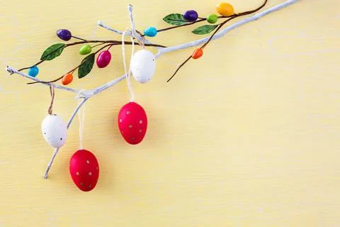 Easter background. Decorative Easter eggs on branch. Copy space Stock Photos