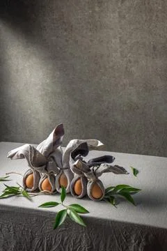 Easter background with Easter bunny made from eggs and linen napkin. Festiv.. Stock Photos