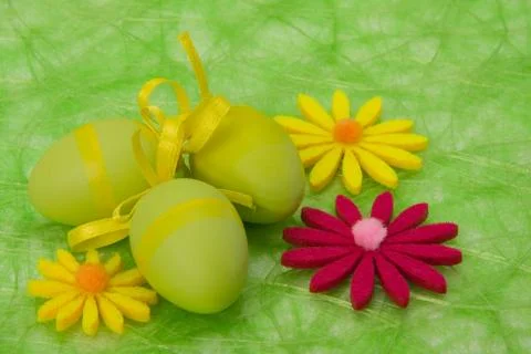 Easter background. easter eggs and flowers. Stock Photos