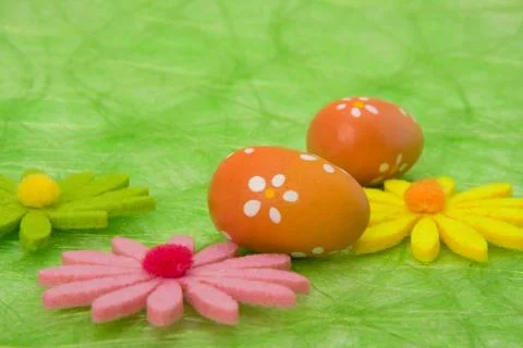 Easter background. easter eggs and flowers. Stock Photos