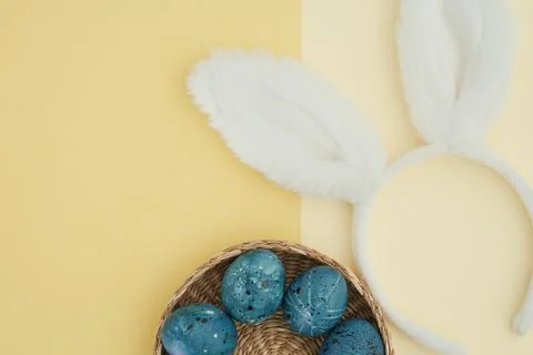 Easter background with easter eggs and bunny ears rim with copy space Stock Photos