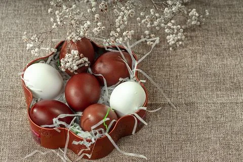 Easter background with Easter eggs and spring flowers. Top view with copy spa Stock Photos