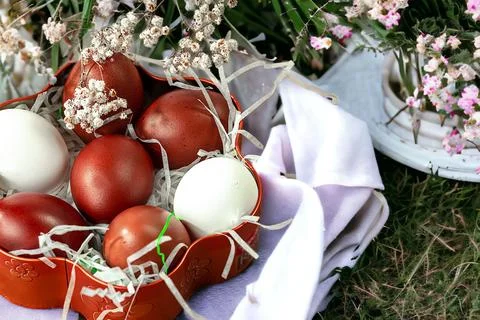 Easter background with Easter eggs and spring flowers. Top view with copy spa Stock Photos